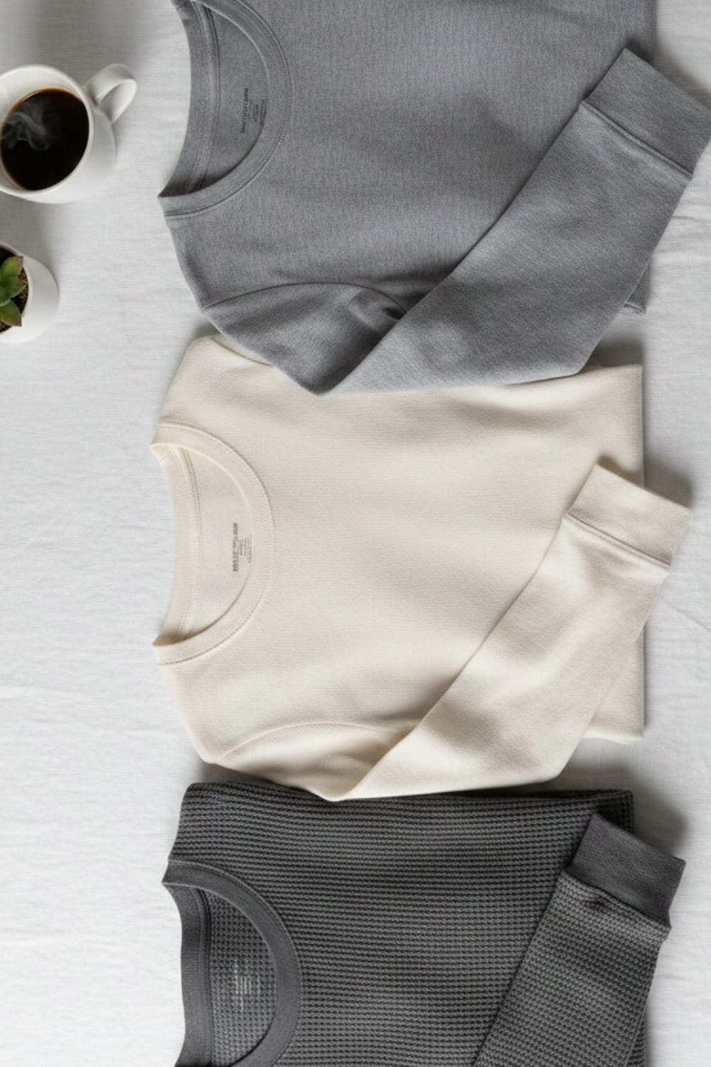 Selection of women's base layer clothing including merino wool and thermal tops for winter layering